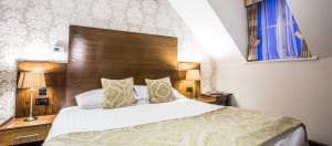Hotel Room Bed & Window | Hotel in Barrow in Furness