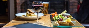 Main course and platter with wine | hotel in Barrow in Furness